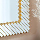 Oglinda decorativa perete cu rama geometrica aurie, 74x55 cm, design modern elegant cu elemente geometrice dispuse diagonal